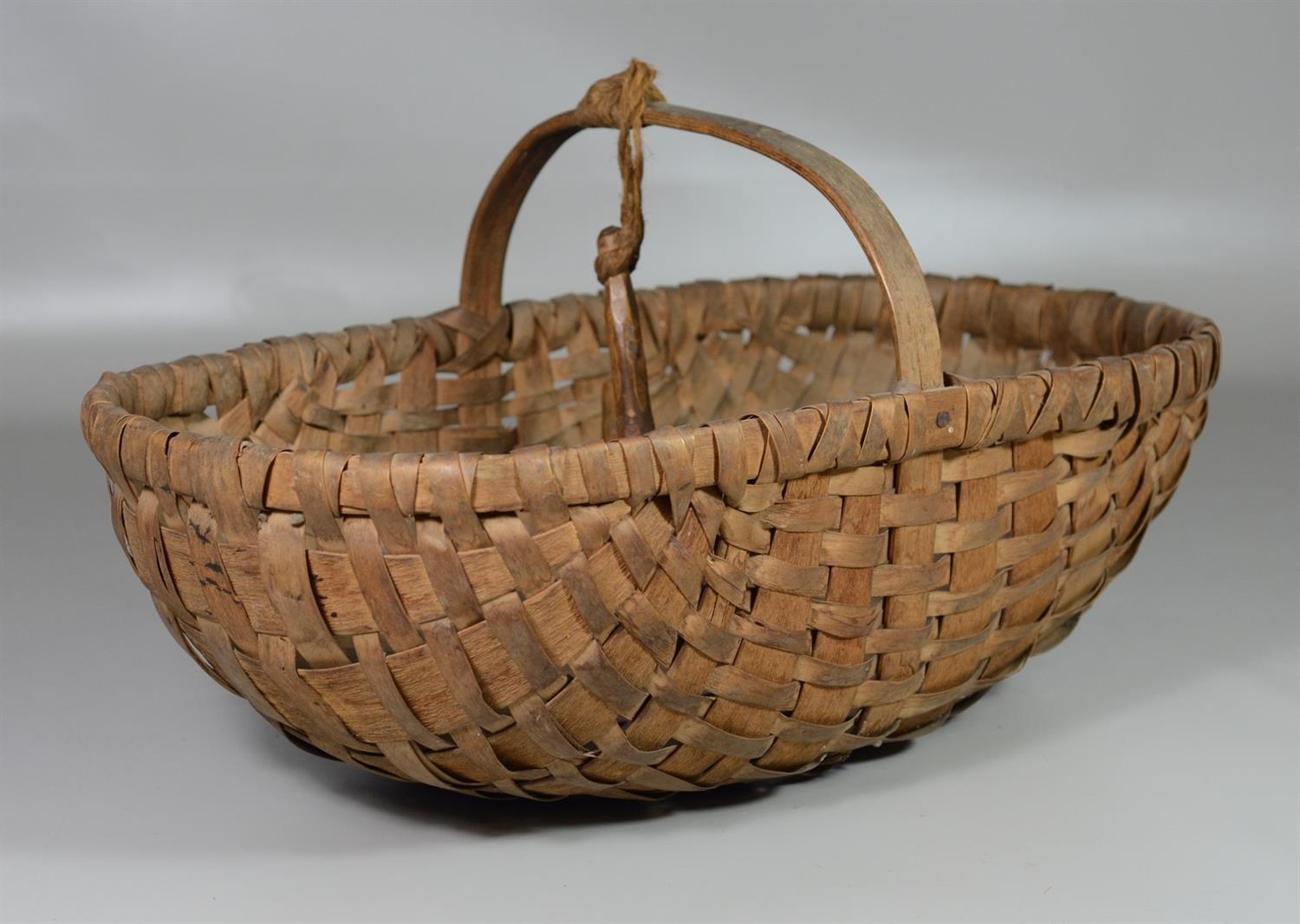 Appraisal: Apple Picking Basket with widdled suspension hook attached to handle