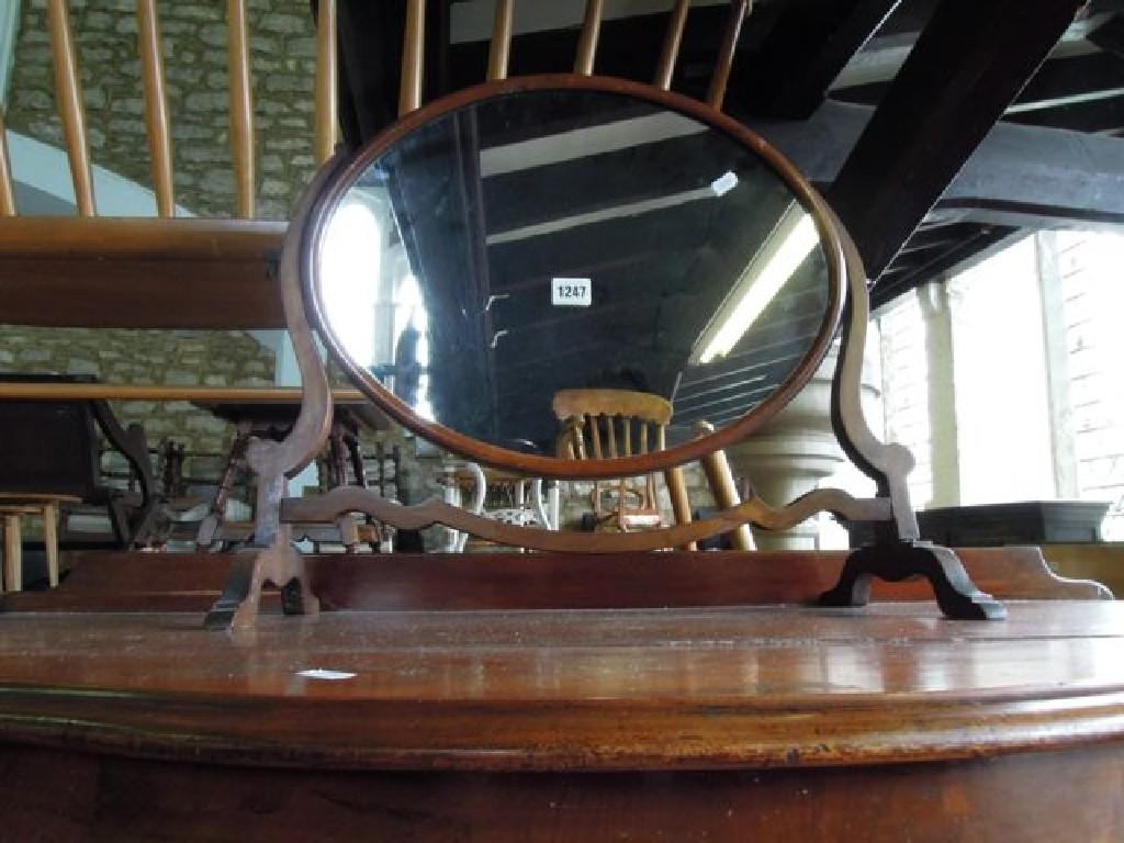 Appraisal: A Georgian style mahogany toilet mirror of oval form with