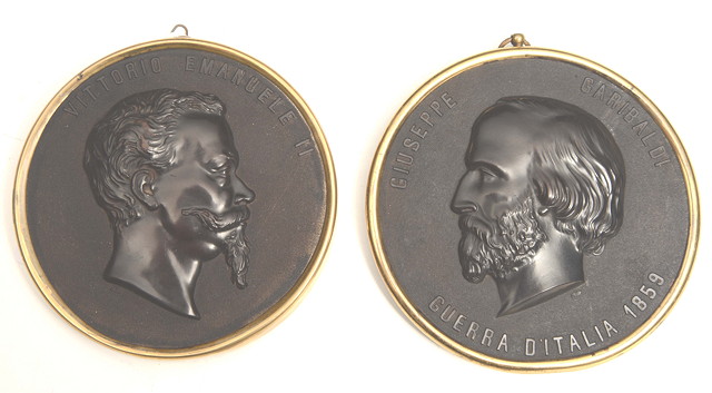 Appraisal: A PAIR OF BOIS DURCI CIRCULAR PLAQUES commemorating Giuseppi Garibaldi