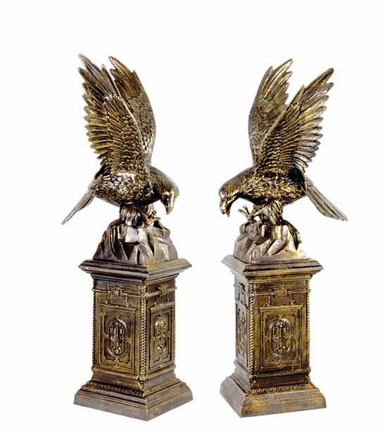 Appraisal: Pair cast-iron figural garden statues eagle taking flight off rock