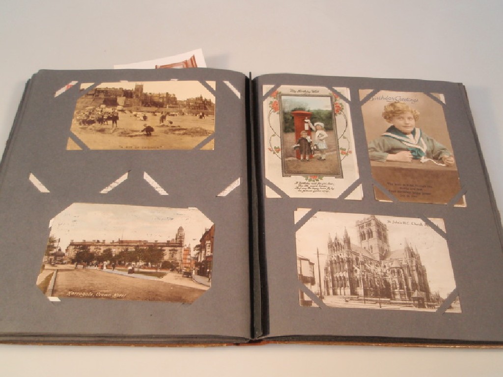 Appraisal: An early thC postcard album containing approximately one hundred postcards