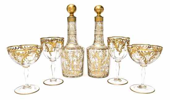 Appraisal: A Continental Gilt Decorated Glass Partial Drinks Set comprising three