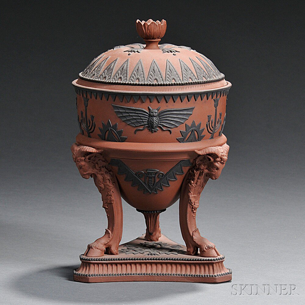 Appraisal: Wedgwood Rosso Antico Egyptian-style Tripod Vase and Cover England early