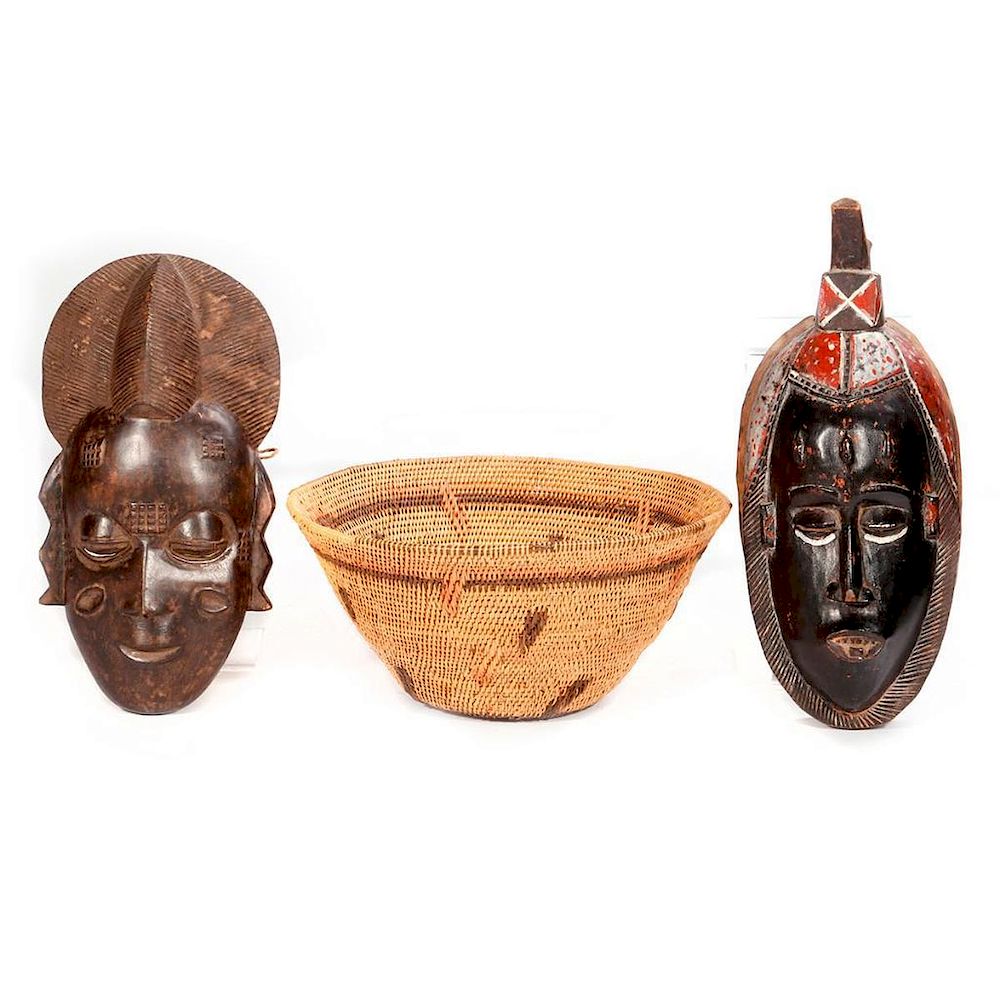 Appraisal: African baskets and masks Two African baskets the largest measuring