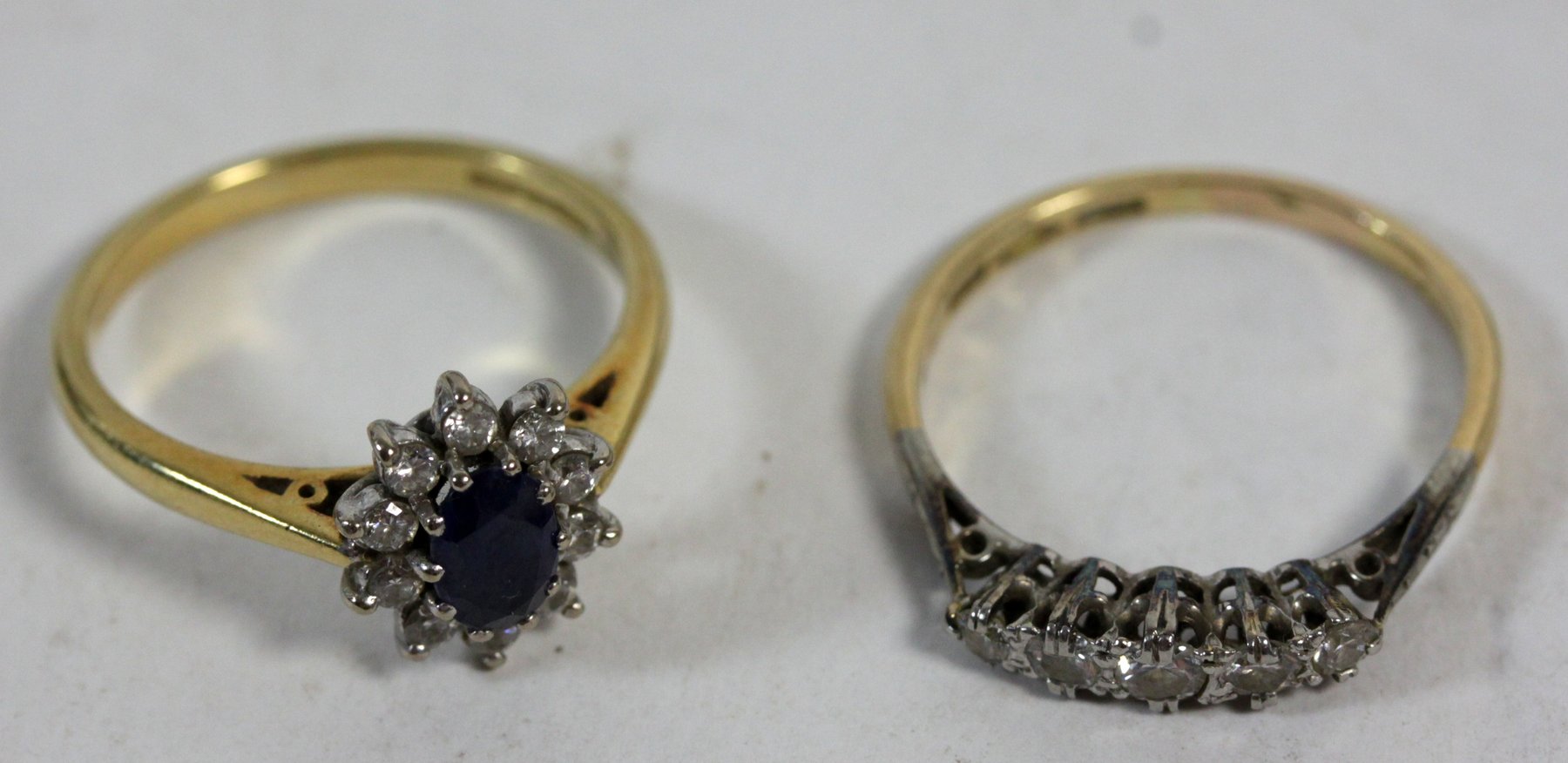 Appraisal: A sapphire and diamond cluster ring claw set on an