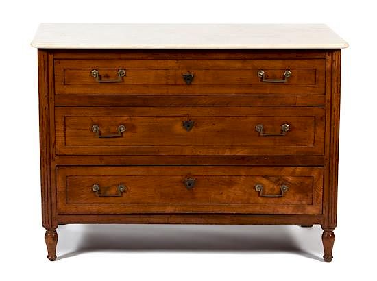 Appraisal: A Continental Provincial Style Carved Fruitwood Marble Top Commode Height