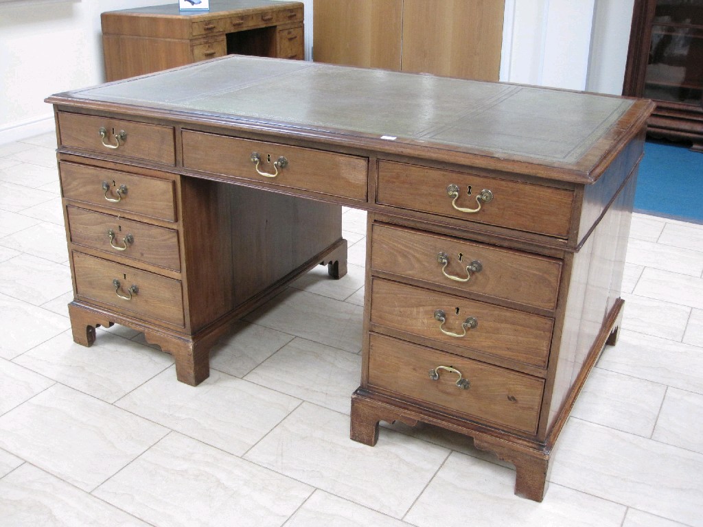 Appraisal: A George III Partner's Desk in mahogany with inset leather