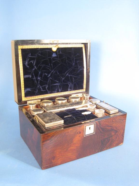 Appraisal: A Victorian rosewood Dressing Case with plated lidded fittings and