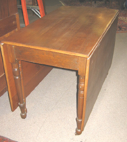 Appraisal: AMERICAN TH CENTURY WALNUT DROP LEAF TABLE Rectangular top with