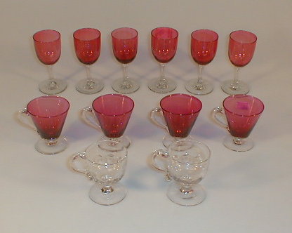 Appraisal: A set of six cranberry glass wines with clear glass