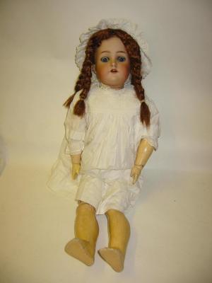 Appraisal: A Kammer Reinhardt bisque head girl doll with blue glass