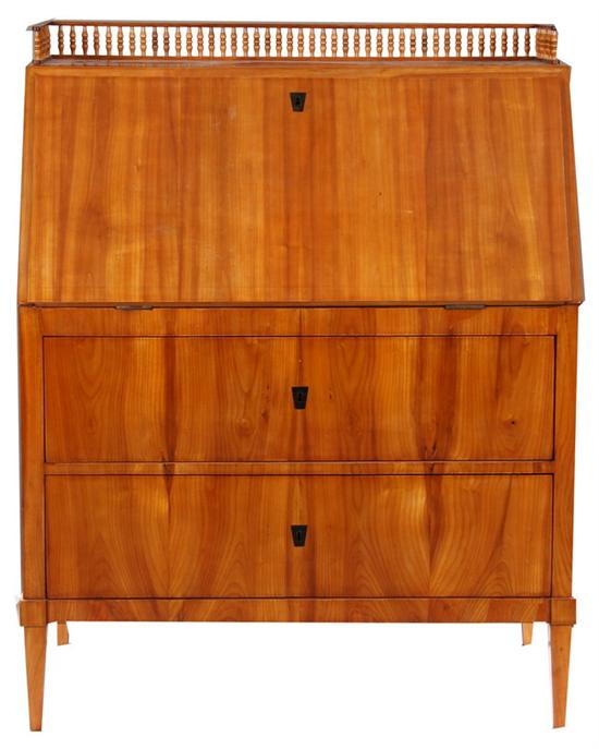 Appraisal: BIEDERMEIER FRUITWOOD SLANT-FRONT DESK th century Balustraded gallery above rectangular