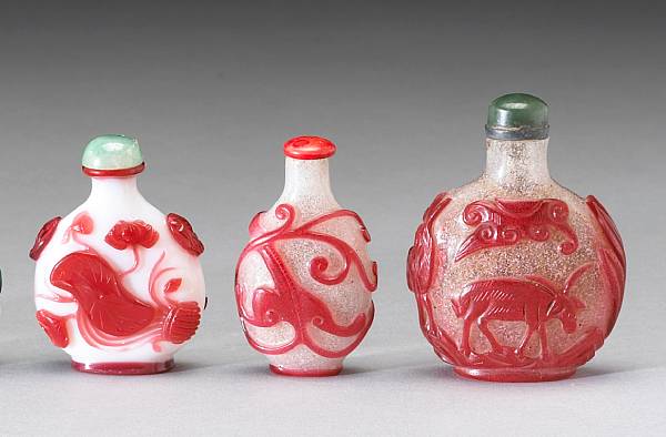 Appraisal: Three red overlay glass snuff bottles The first carved with