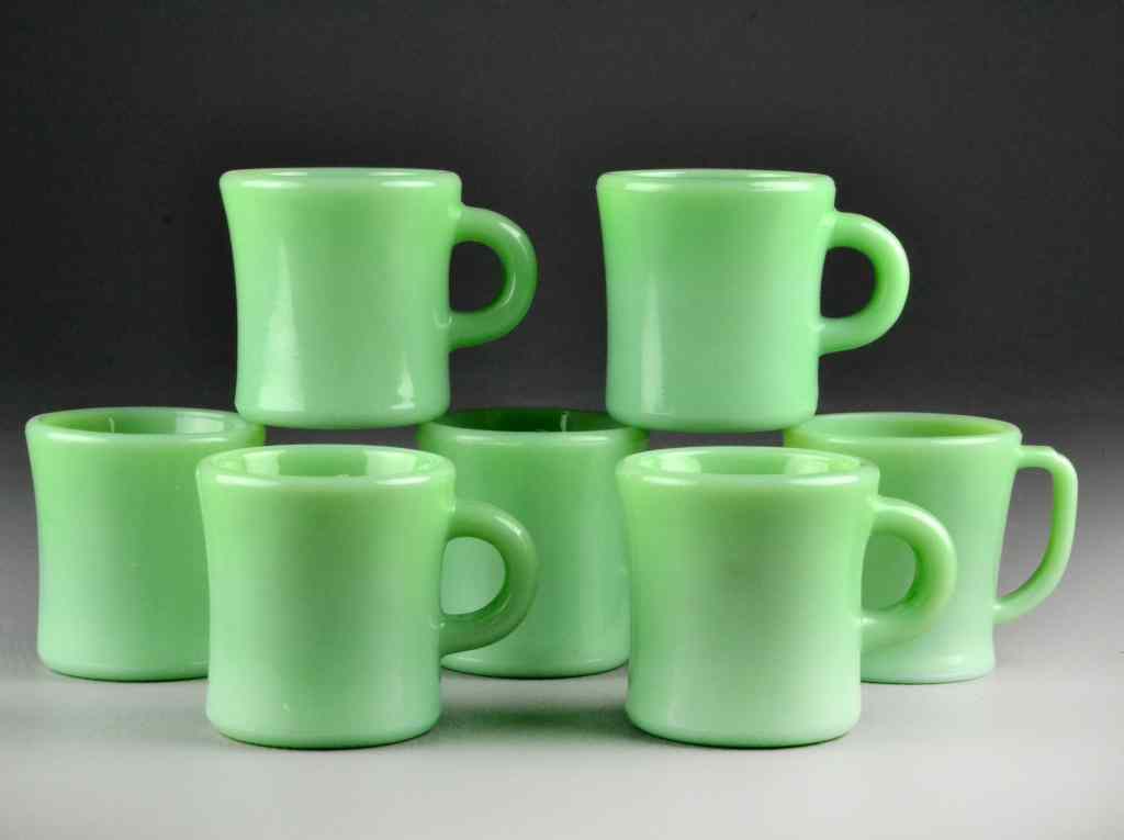 Appraisal: Fire King Jadeite MugsConsisting of six 'C' handle mugs and