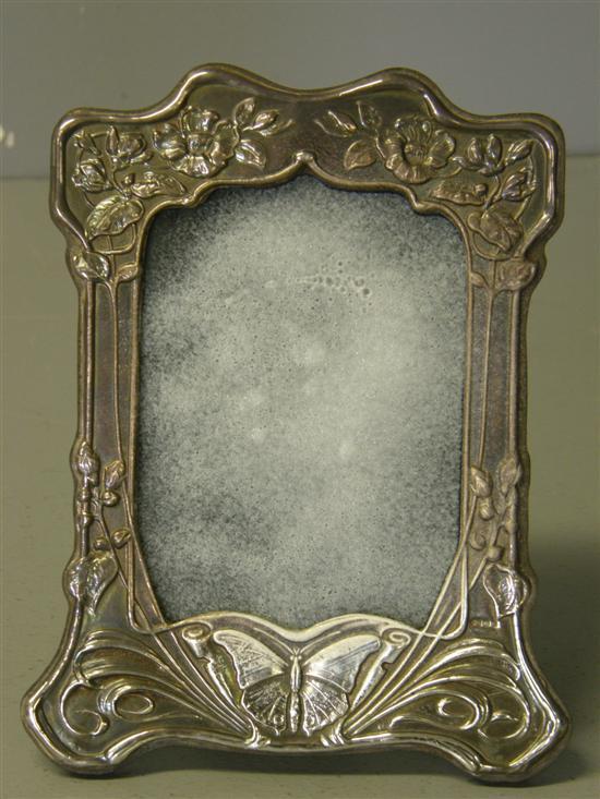 Appraisal: Modern Art Nouveau style silver strut photograph frame with embossed