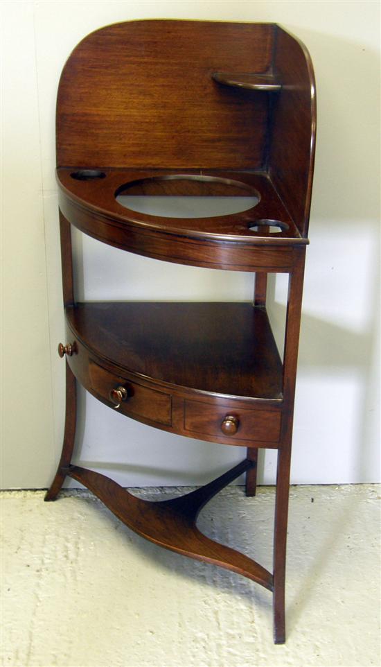 Appraisal: A th century mahogany two tier corner washstand the top