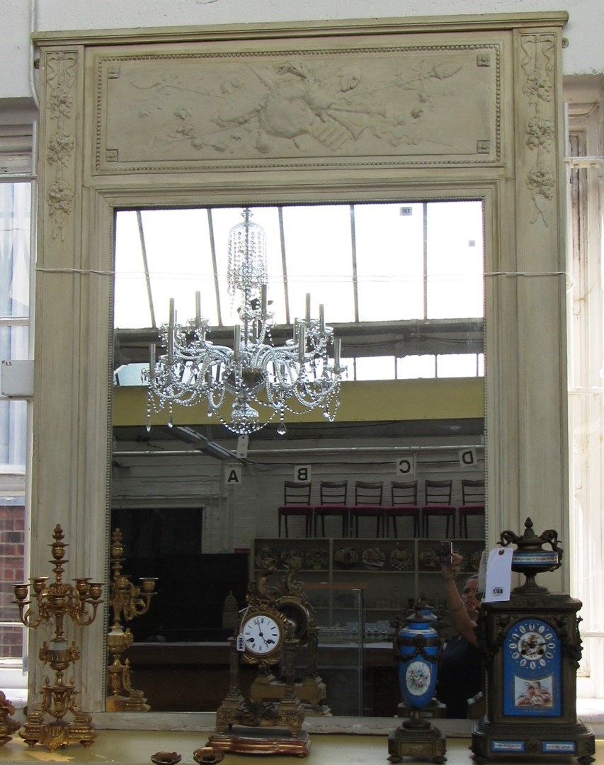 Appraisal: A white painted wall mirror the upper frieze relief moulded