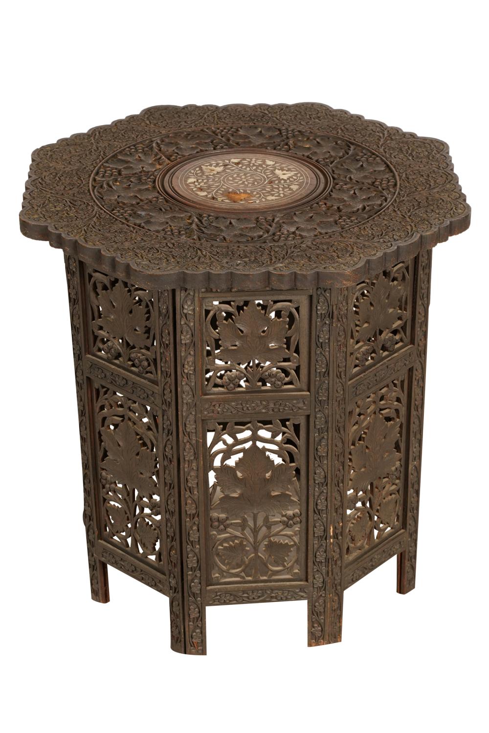 Appraisal: LEVANTINE STYLE CARVED WOOD FOLDING SIDE TABLEoctagonal the relief-carved top