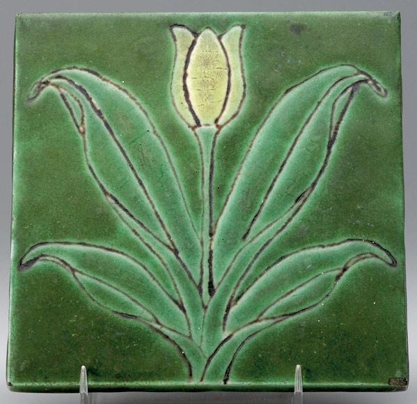 Appraisal: GRUEBY Dust-pressed tile decorated in cuerda seca with a yellow