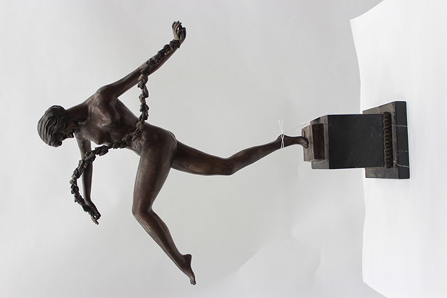 Appraisal: A BRONZE FIGURE of a dancing girl holding a garland