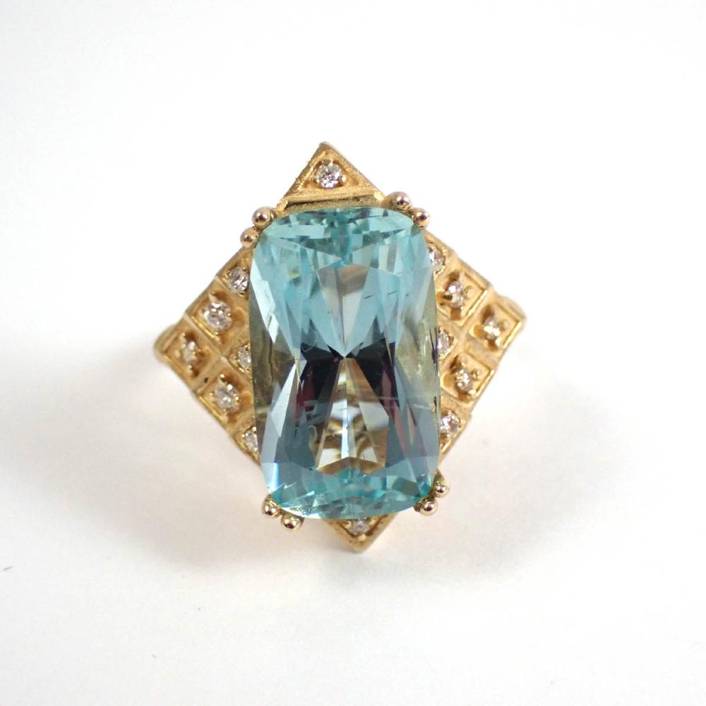 Appraisal: AQUAMARINE DIAMOND AND FOURTEEN KARAT GOLD RING with round-cut diamonds