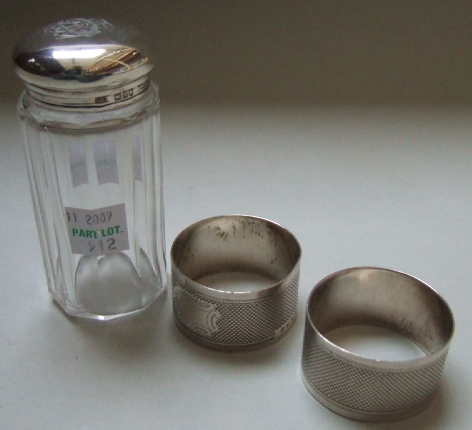 Appraisal: A pair of Victorian silver napkin rings each with engine