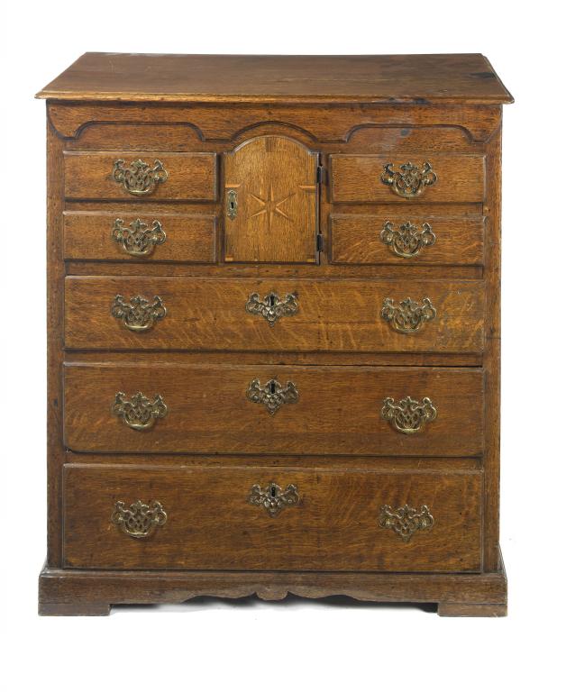 Appraisal: A GEORGE III OAK CHEST OF DRAWERS fitted two pairs