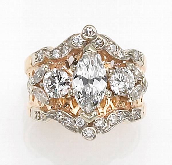 Appraisal: A diamond and eighteen karat bicolor gold ring centering a