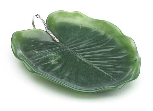 Appraisal: A Cartier nephrite platinum diamond and sapphire leaf-form dish s