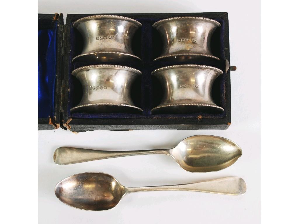 Appraisal: BOXED SET OF FOUR SILVER NAPKIN RINGS of waisted form