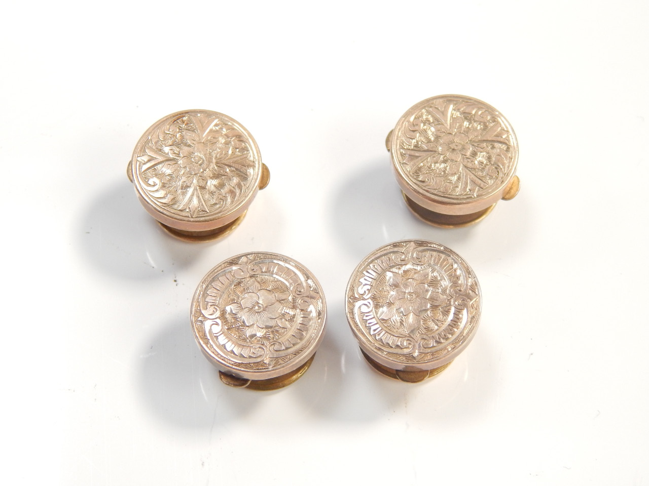 Appraisal: Four West Patent dress buttons in yellow metal with brass