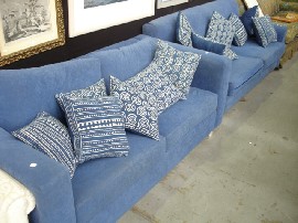 Appraisal: Two modern blue upholstered two seater sofas including several cushions