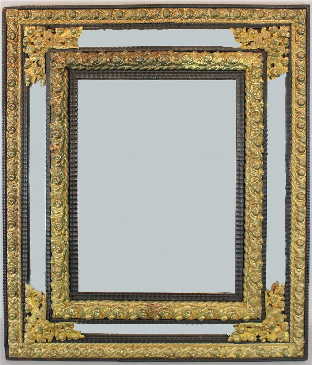 Appraisal: ANTIQUE DUTCH BRASS AND EBONIZED BEVELED MIRROR AND GILT FRAME