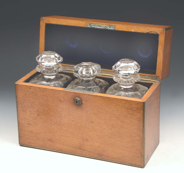 Appraisal: A SET OF THREE HEAVY GLASS SPIRIT DECANTERS within a