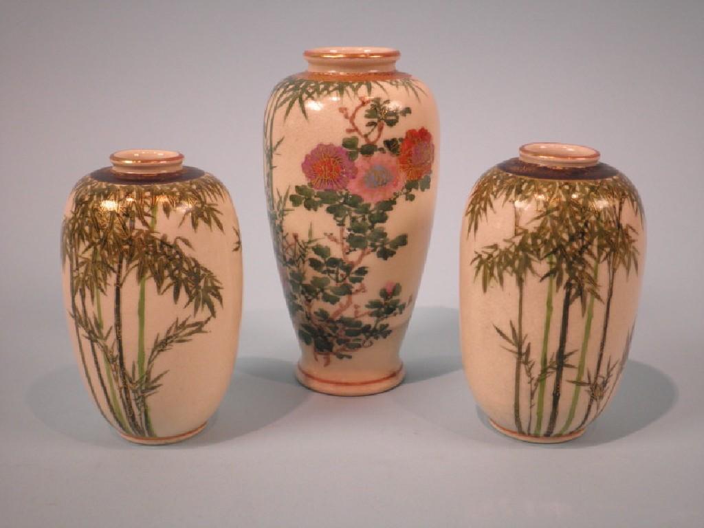 Appraisal: A pair of Japanese earthenware vases each painted with bamboo