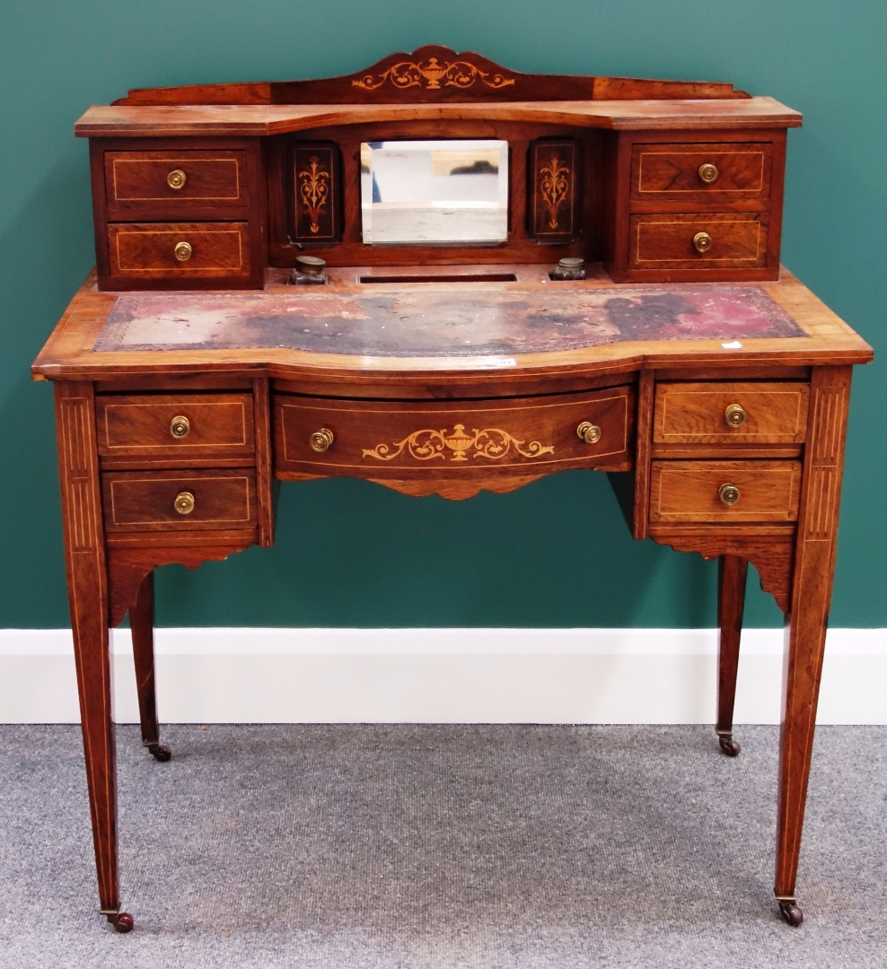 Appraisal: A late Victorian marquetry inlaid writing desk with fitted superstructure