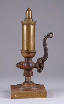 Appraisal: SMALL BRASS WHISTLE Acorn finial mounted on a wooden base