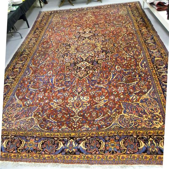 Appraisal: Antique Persian Herez carpet red field with indigo cream green