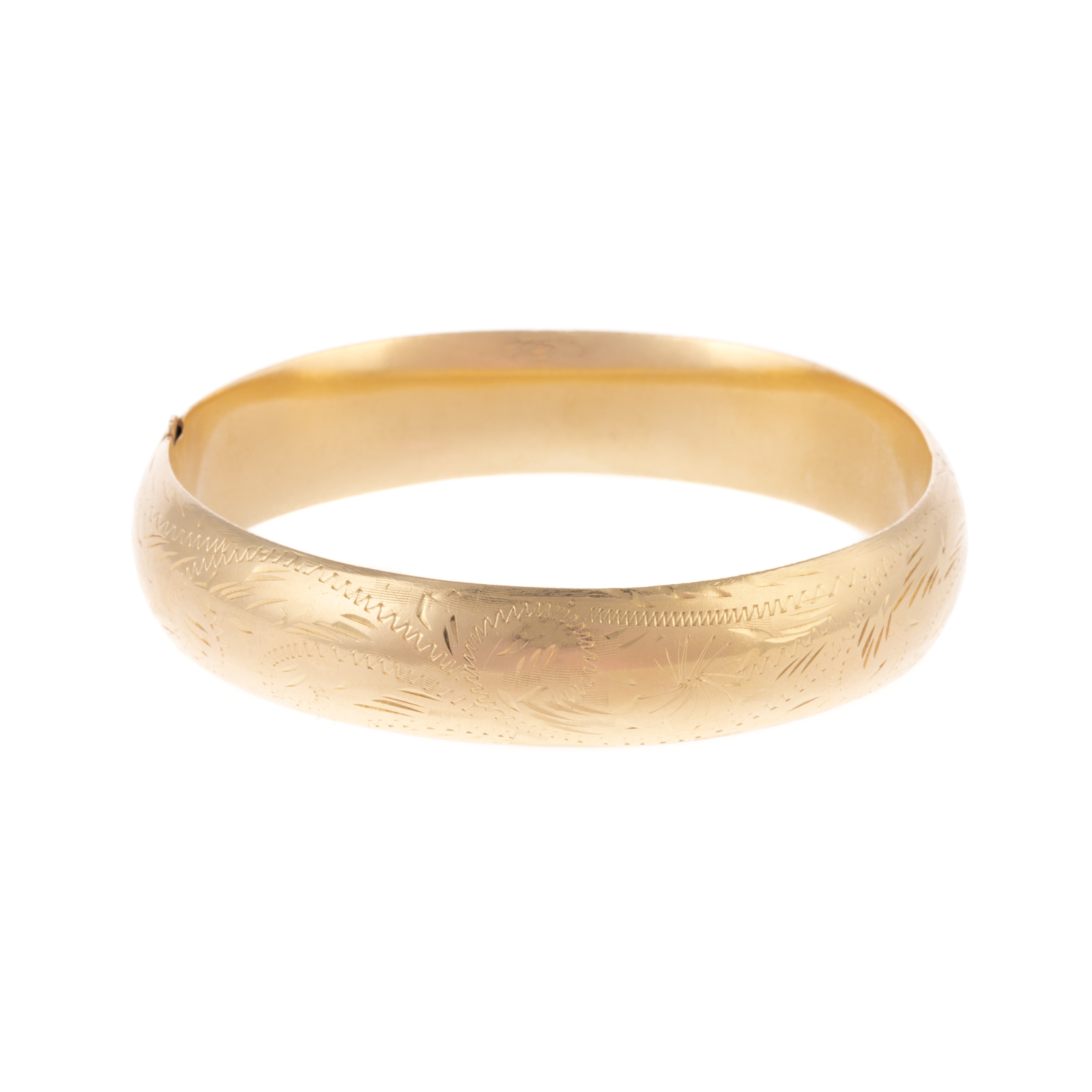 Appraisal: AN ENGRAVED BANGLE IN K YELLOW GOLD K yellow gold