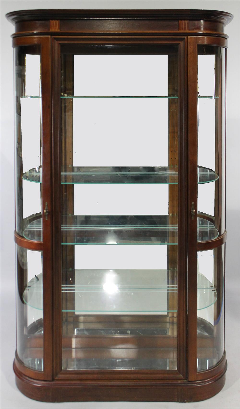 Appraisal: FEDERAL STYLE MAHOGANY CURVED LIGHTED GLASS DISPLAY CABINET having a