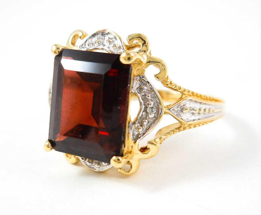 Appraisal: PYROPE GARNET DIAMOND AND TEN KARAT GOLD RING with a