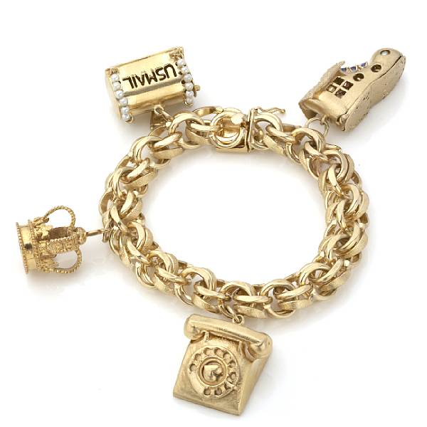 Appraisal: A k gold charm bracelet with four gold charms grams