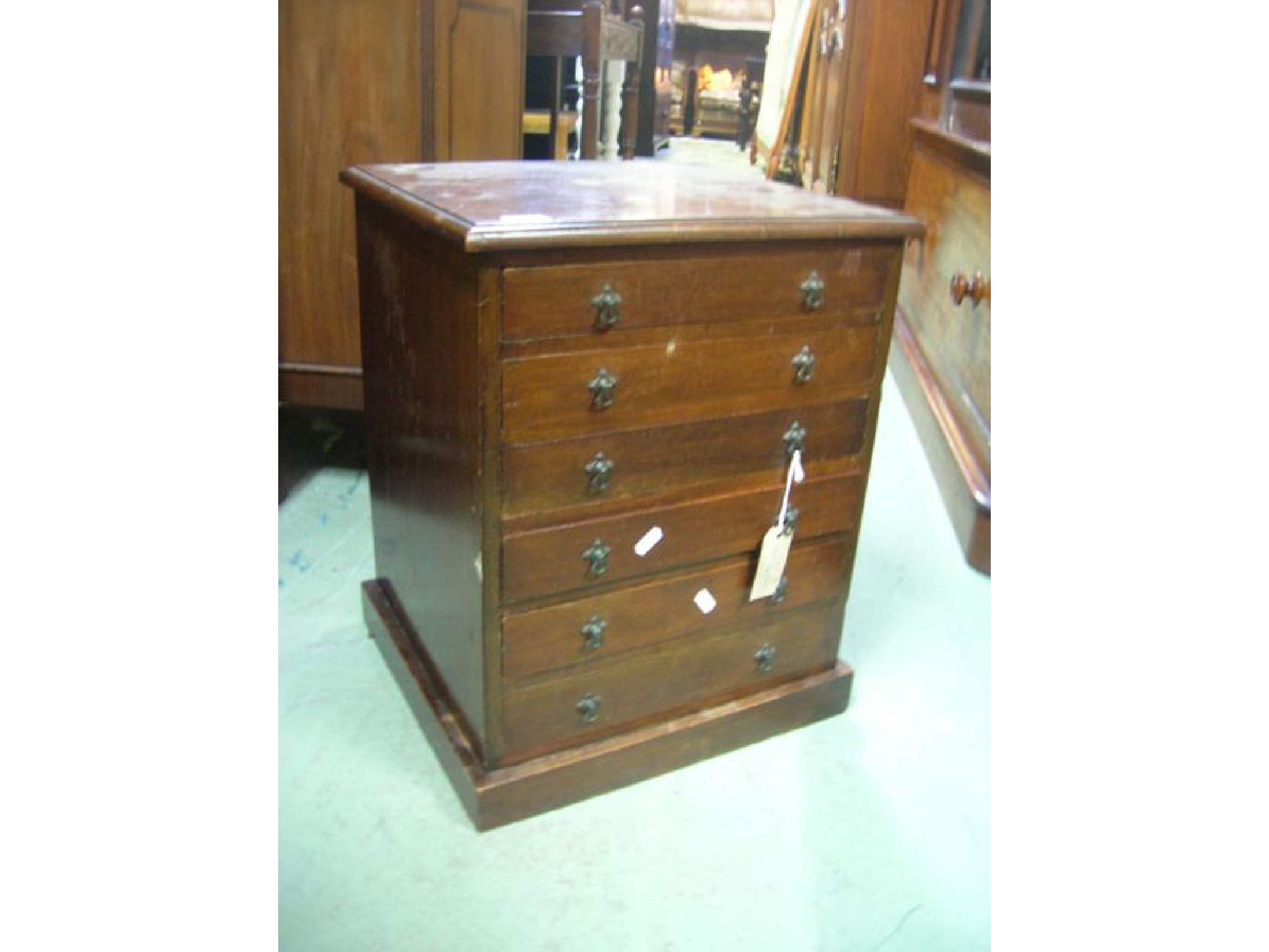 Appraisal: A Victorian walnut miniature chest or collectors cabinet fitted with