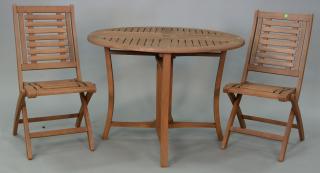 Appraisal: Teak three piece outdoor table set including pair of folding