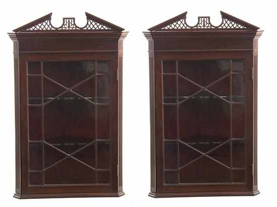 Appraisal: Pair Georgian style mahogany hanging corner cabinets late th century