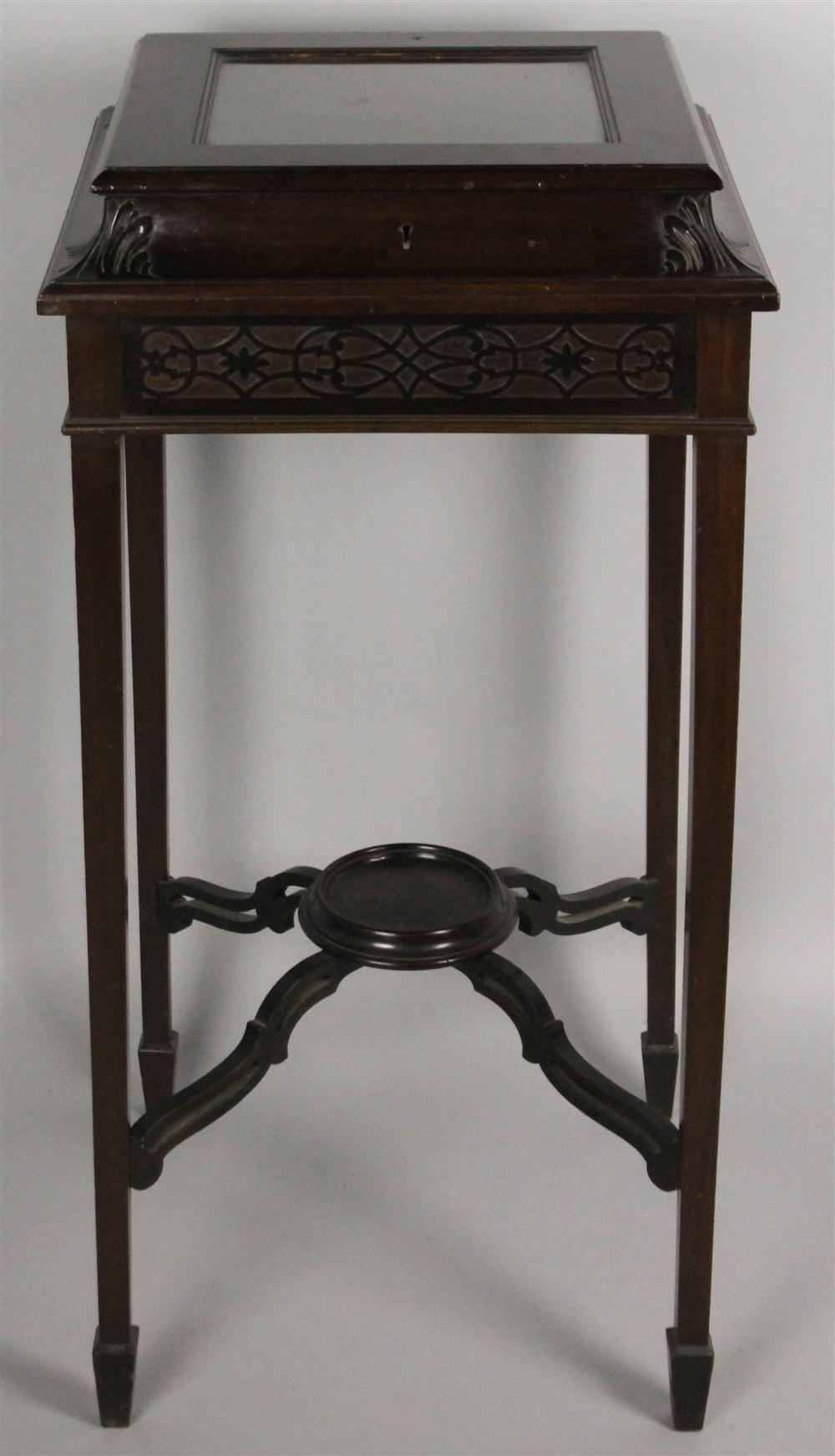 Appraisal: EDWARDIAN CARVED MAHOGANY VITRINE having a rectangular top with glass