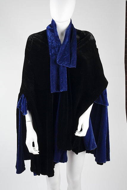 Appraisal: A s royal blue and black velvet lined cape with