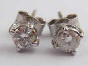 Appraisal: A pair of diamond ear studs the round brilliant cut