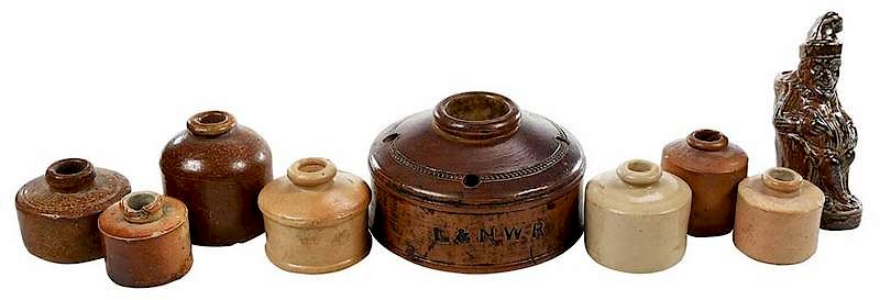 Appraisal: Nine Stoneware Inkwells Including Mr Punch British th century Mr