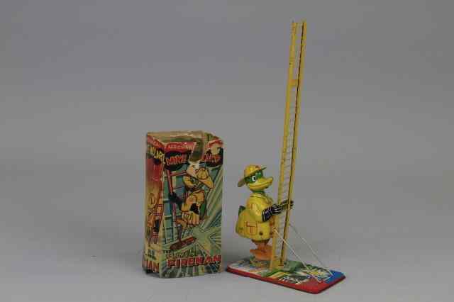 Appraisal: MIKE MALLARD CLIMBING FIREMAN Linemar Toys lithographed tin depicts climbing